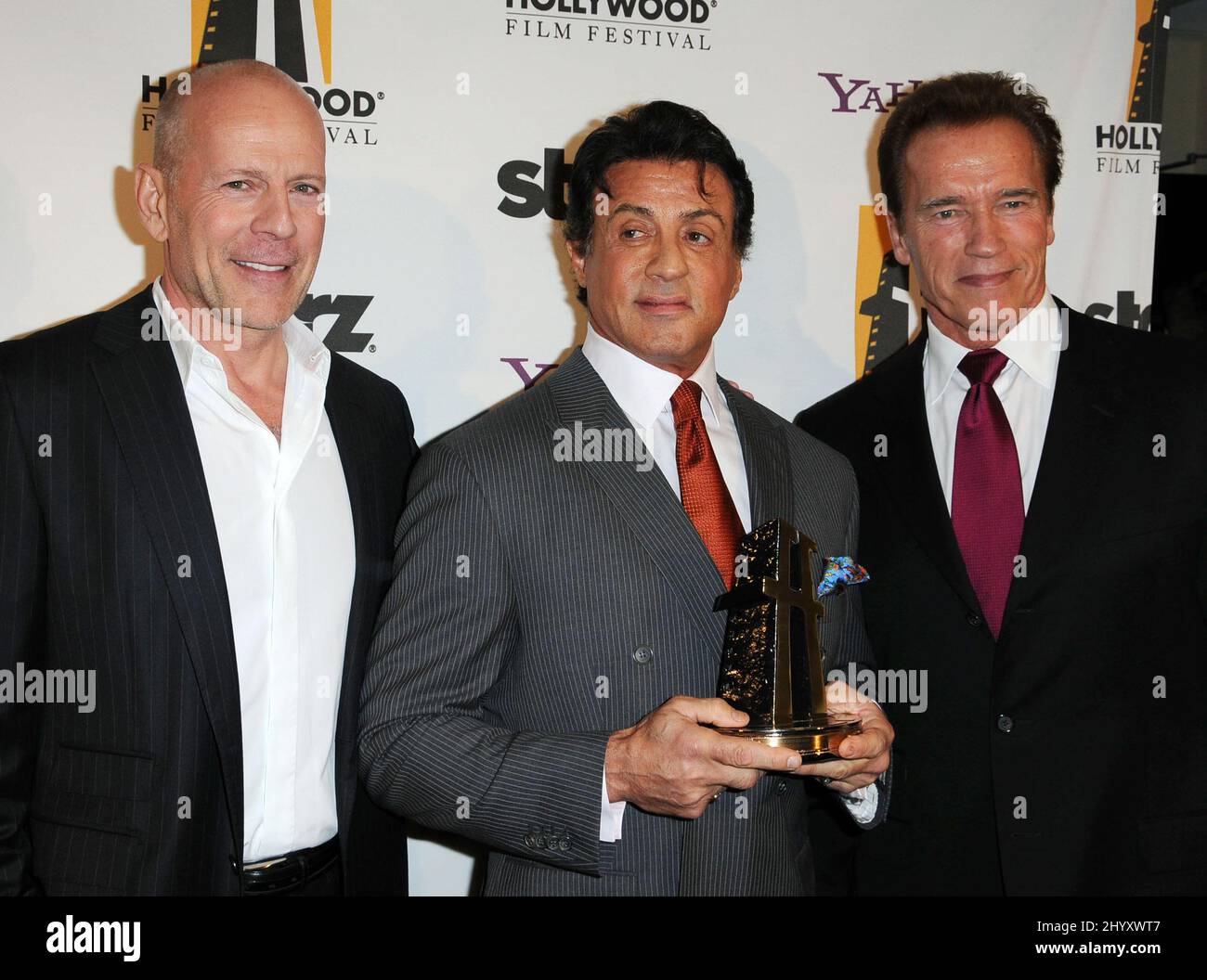 Bruce Willis, Sylvester Stallone and Arnold Schwarzenegger at the 14th Annual Hollywood Awards Gala held at the Beverly Hilton Hotel, Beverly Hills, California. Stock Photo