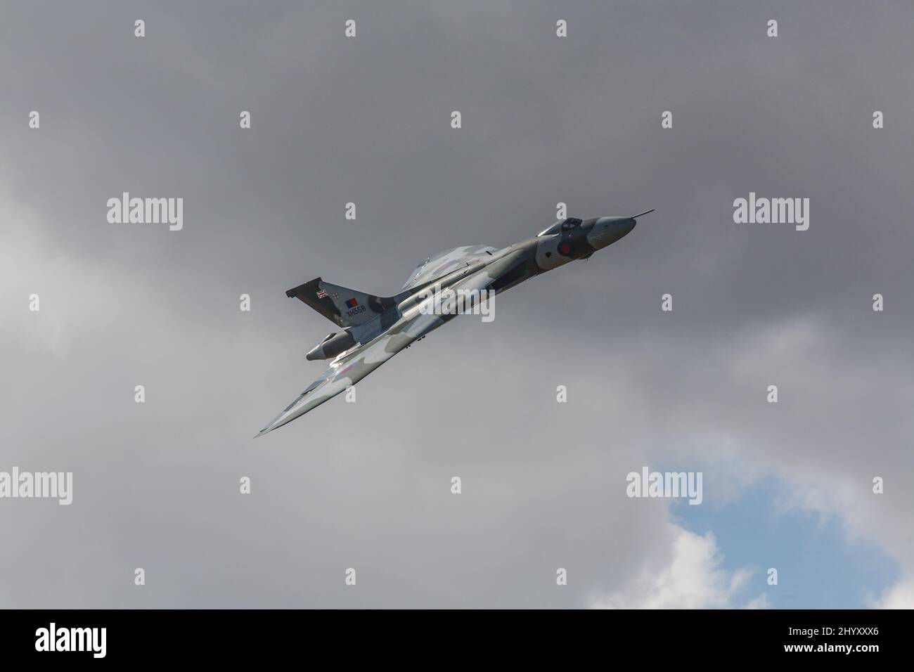 A Vulcan bomber flies in front of a leaden sky Stock Photo