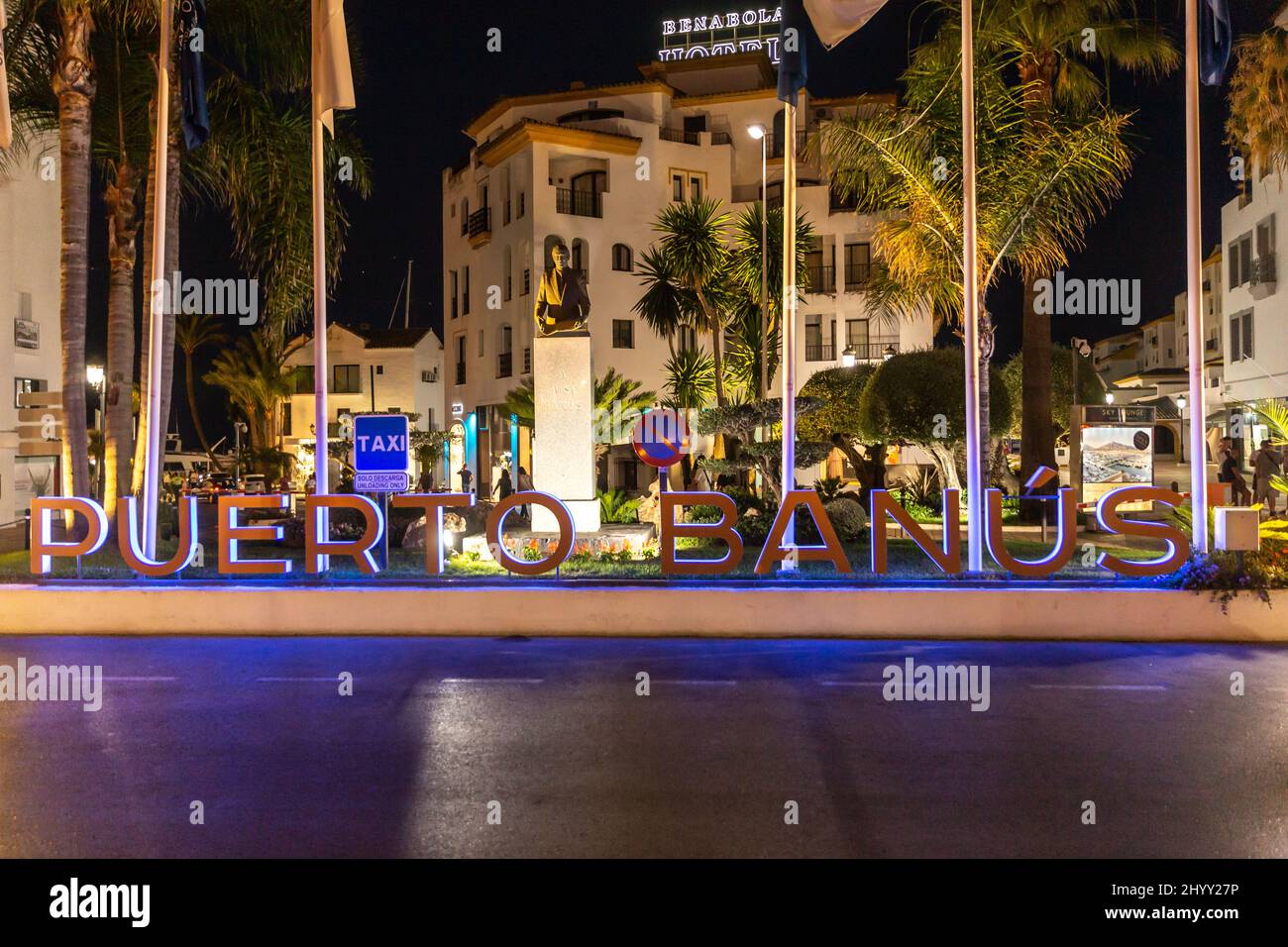 Night photography in luxury and famous location of Marbella - Puerto Banus Bay. View of Puerto Banus sign, on Julio Iglesias Avenue Stock Photo