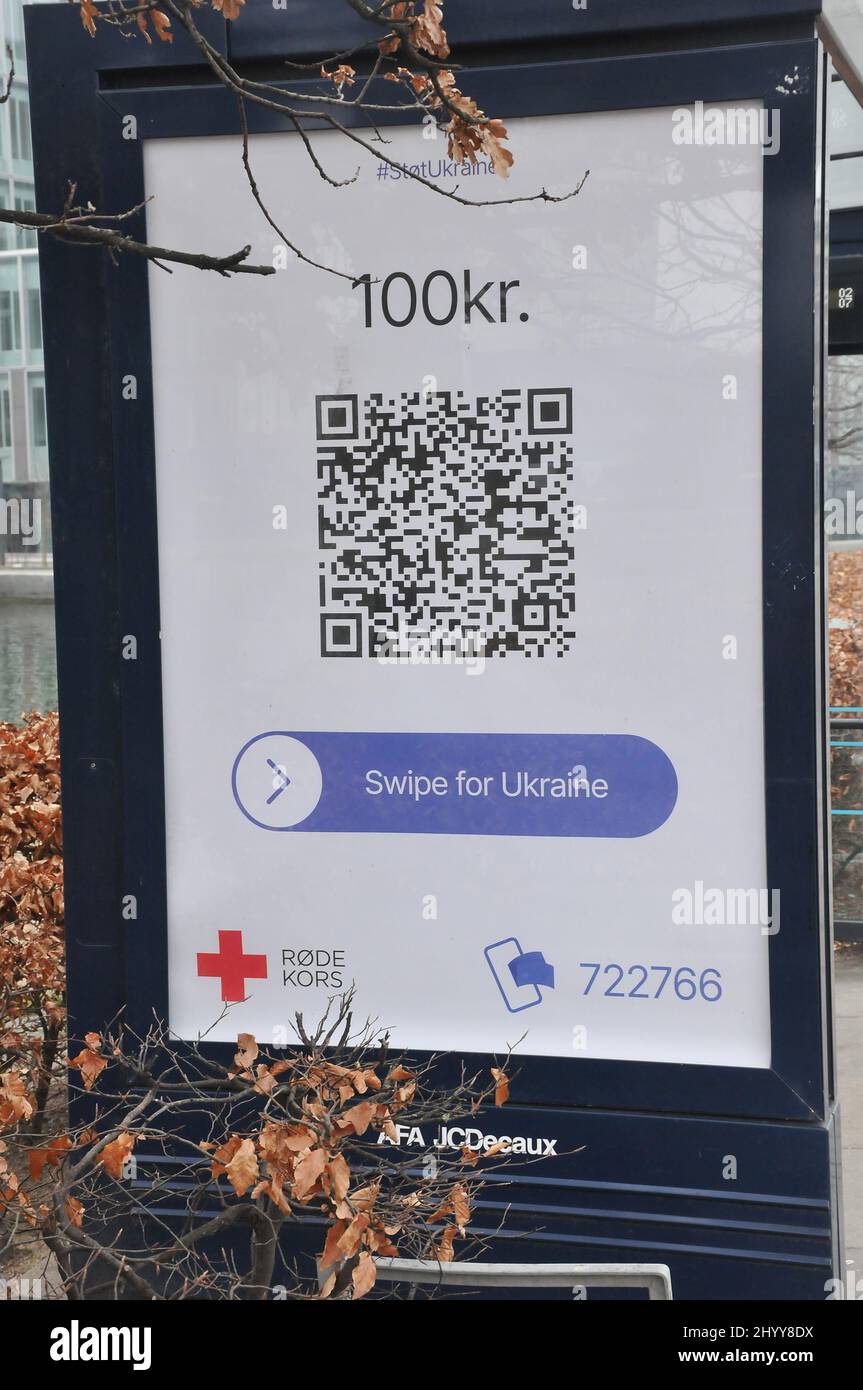 Copenhagen/Denmark.15 .March 2022/.Red cross billboard Swipe for Ukraine 100 danish korner in Copenhagen Denmark.    (Photo..Francis Dean/Dean Pictures) Stock Photo