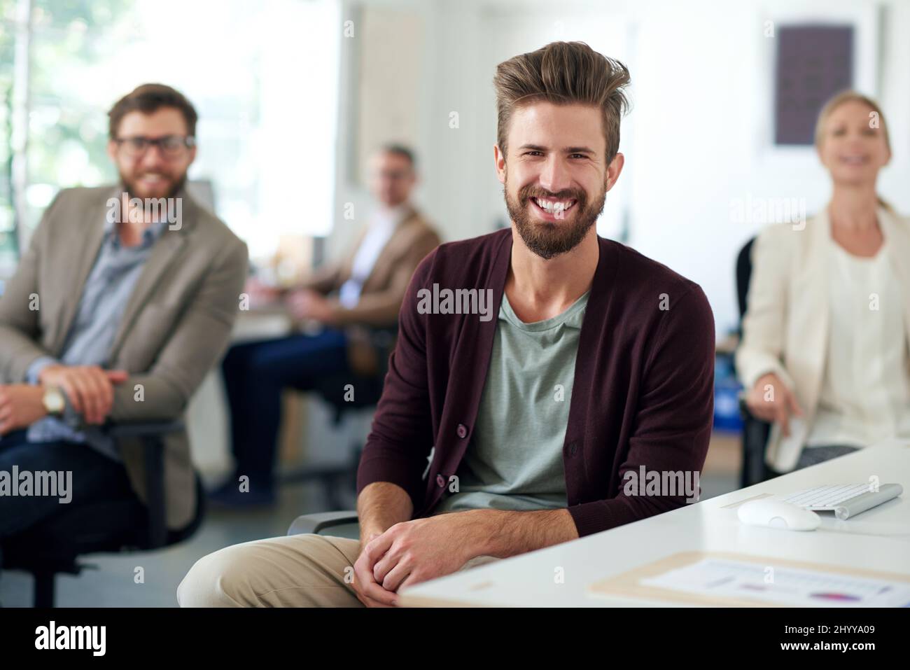 Colleague Promise Modern leadership looks full of promise. Smiling creative professional ...