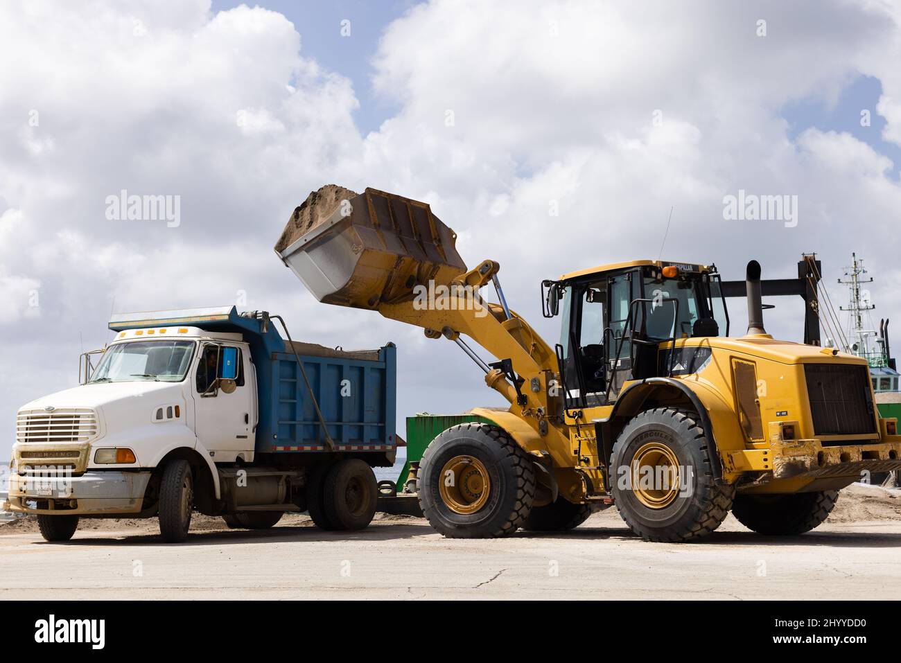 Delivery of dirt. Automotive equipment loading black soil Stock Photo Alamy