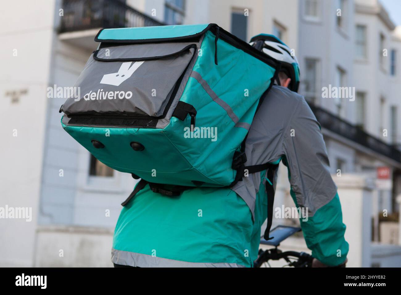 Deliveroo courier in Brighton, East Sussex Stock Photo