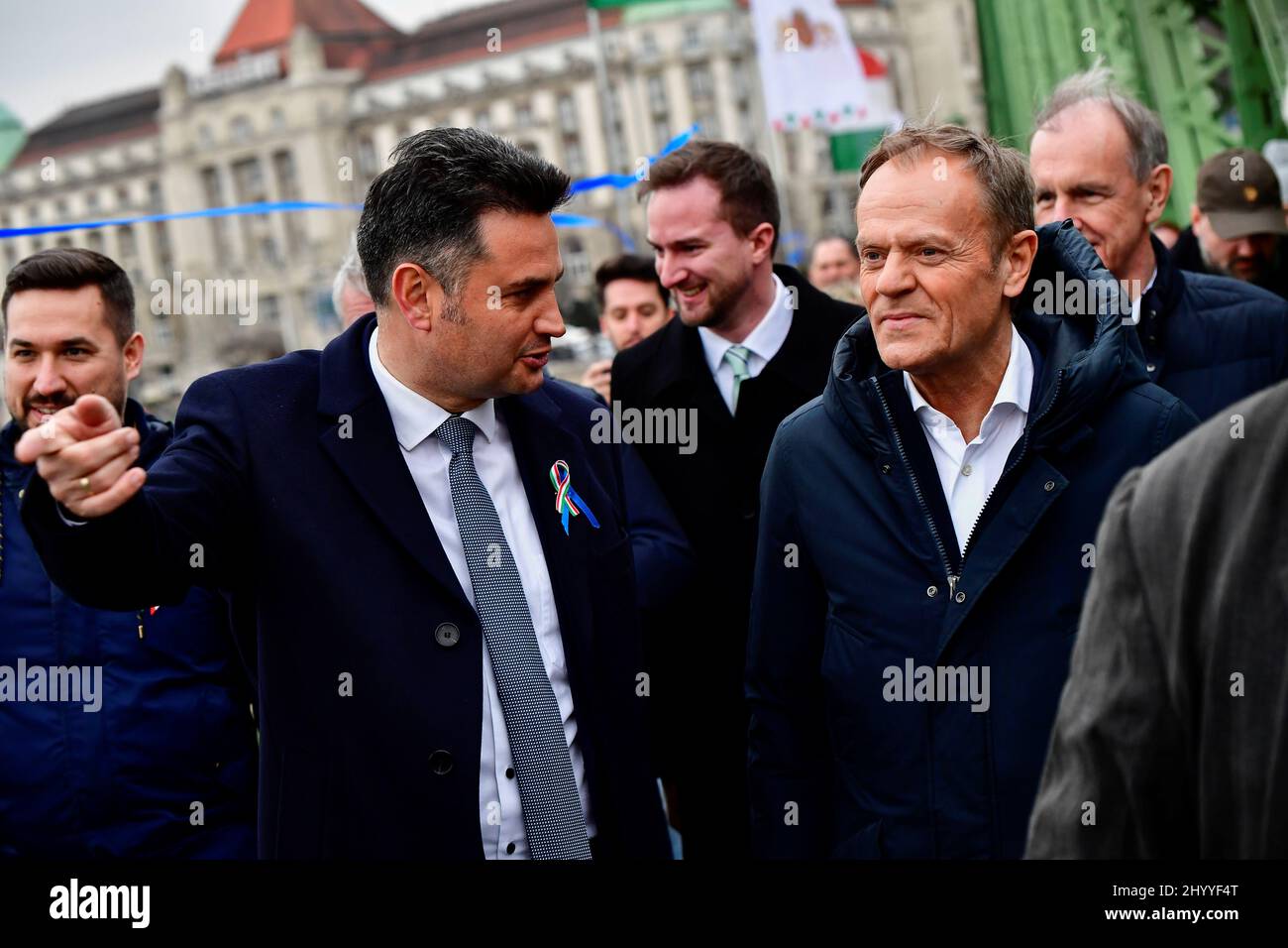 Opposition candidate for prime minister Peter Marki-Zay talks with  president of the European People's Party (EPP) Donald Tusk as they attend a  joint demonstration organised by opposition parties as Hungary's National  Day