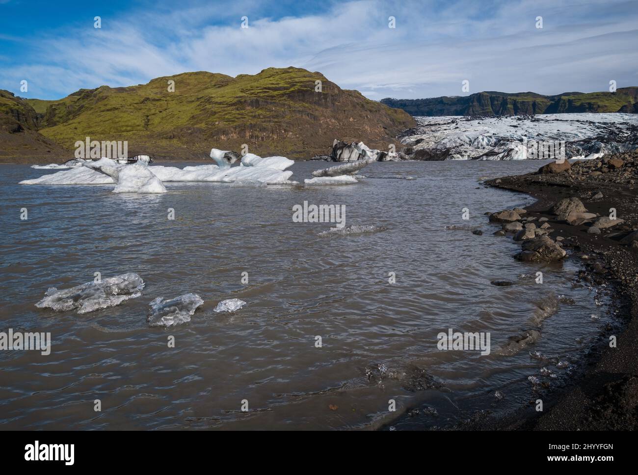 Solheimajokull picturesque glacier in southern Iceland. The tongue of this glacier slides from the volcano Katla. Beautiful glacial lake lagoon with b Stock Photo