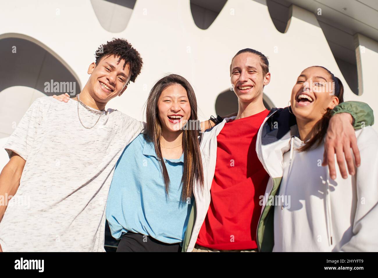 Group of friends having fun together outdoors. Portrait of multiethnic young students looking at the camera Stock Photo