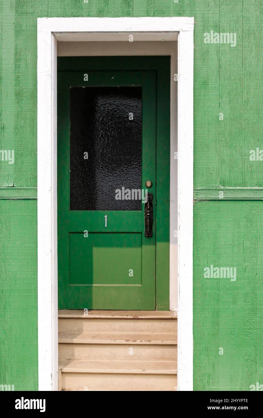 Building entrance with green walls and door Stock Photo - Alamy