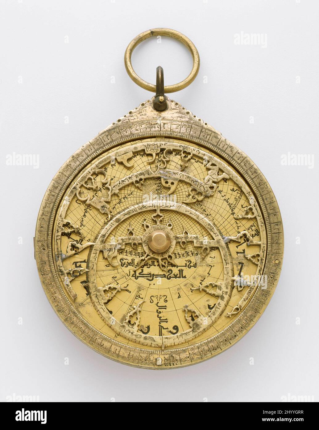 Astrolabe. Muhammad ibn 'Abd al-'Aziz al Khama'iri (Spain, active 13th century). Spain, Seville, Spanish, 1226-1227/624 A.H.. Metal. Gilt copper alloy Stock Photo