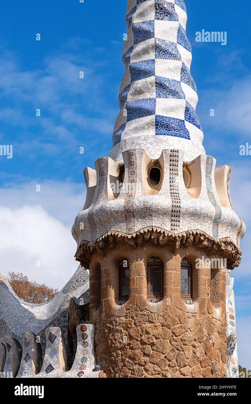 PARK GUELL BARCELONA CATALONIA SPAIN THE COLOURFUL GAUDI MOSAICS ON THE BLUE AND WHITE MOSAIC TOWER Stock Photo