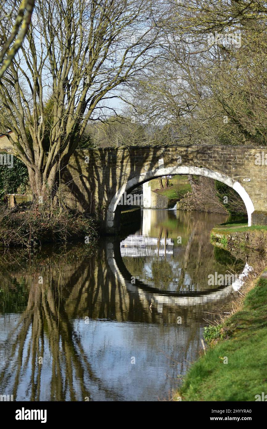 Reflections and shadows, on canal bridge,  Leeds and Liverpool canal, Dowley Gap, Bingley Stock Photo