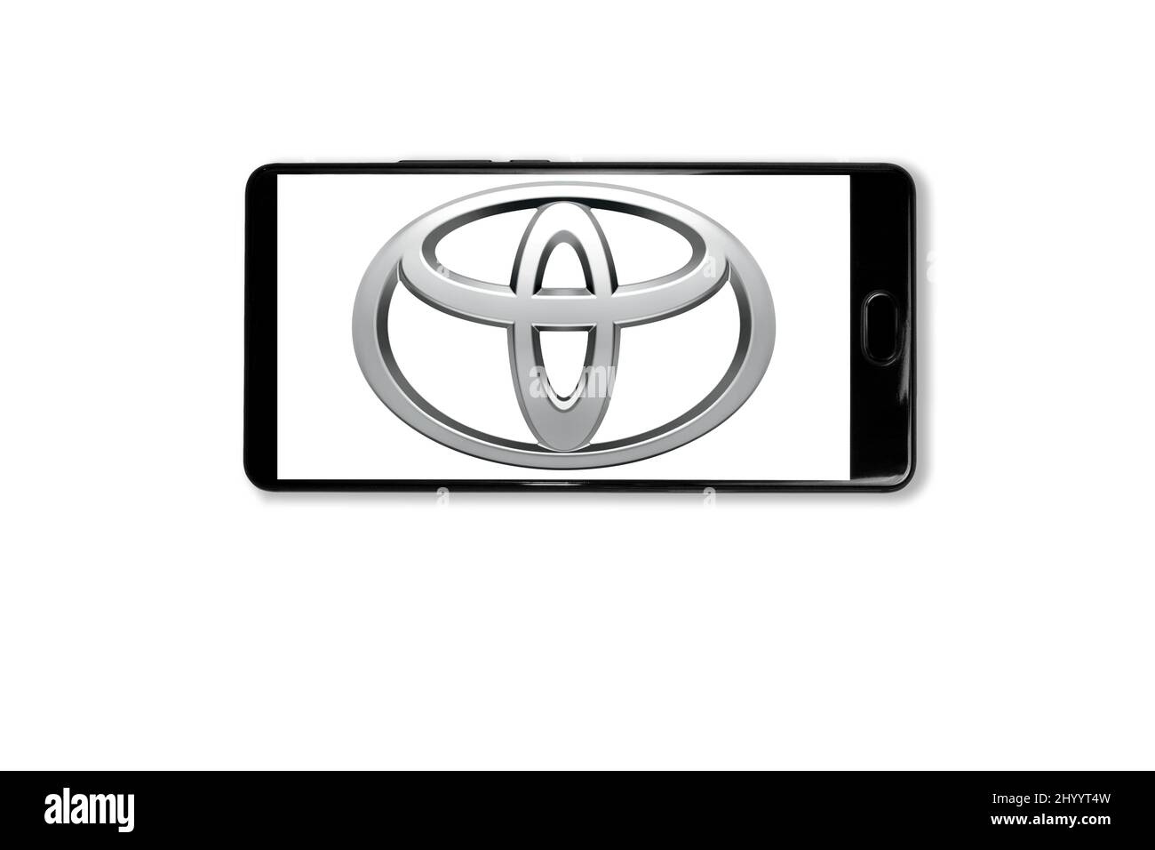 Kostanay, Kazakhstan, March 15, 2022.Mobile phone with Toyota logo on screen.Shot in studio on white background Stock Photo