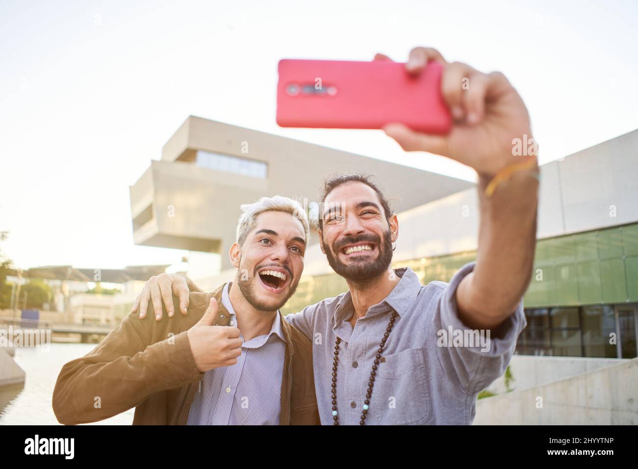 Happy gay couple taking smiling selfie. Homosexual people having fun Stock Photo