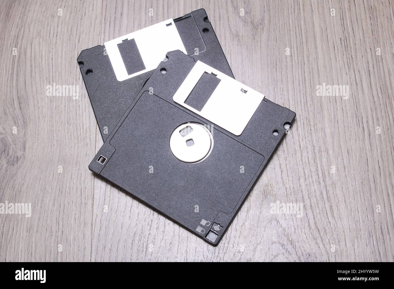 Two floppy disks on a wooden table close up Stock Photo