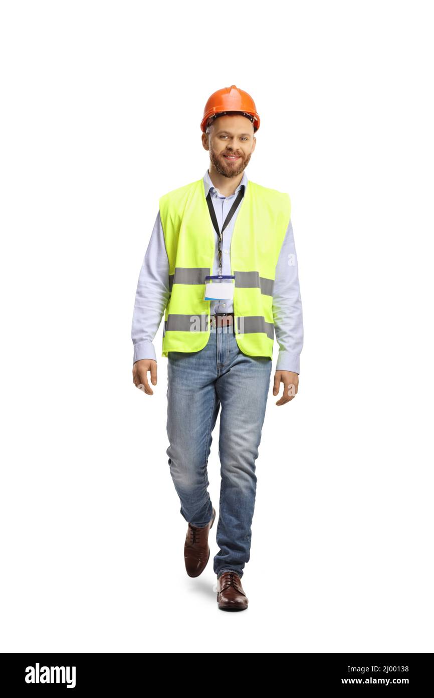 Full length portrait of a site engineer wearing a reflective vest and