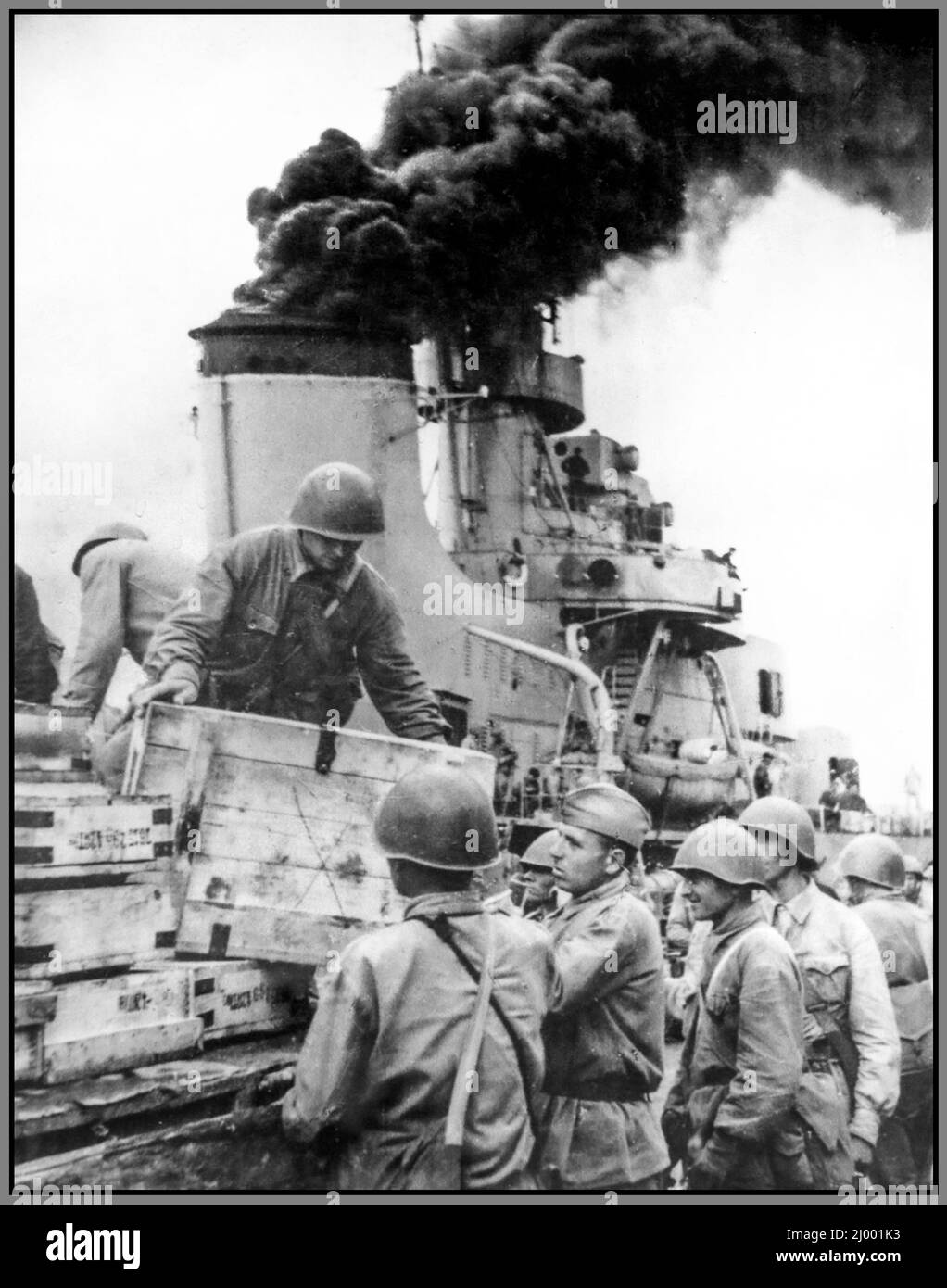 USSR Soviet WW2 Loading reinforcements and ammunition on board the leader of the Russian “Tashkent” destroyers, going to help the besieged Sevastopol. Location: Batumi, Georgia, USSR 1942 Stock Photo