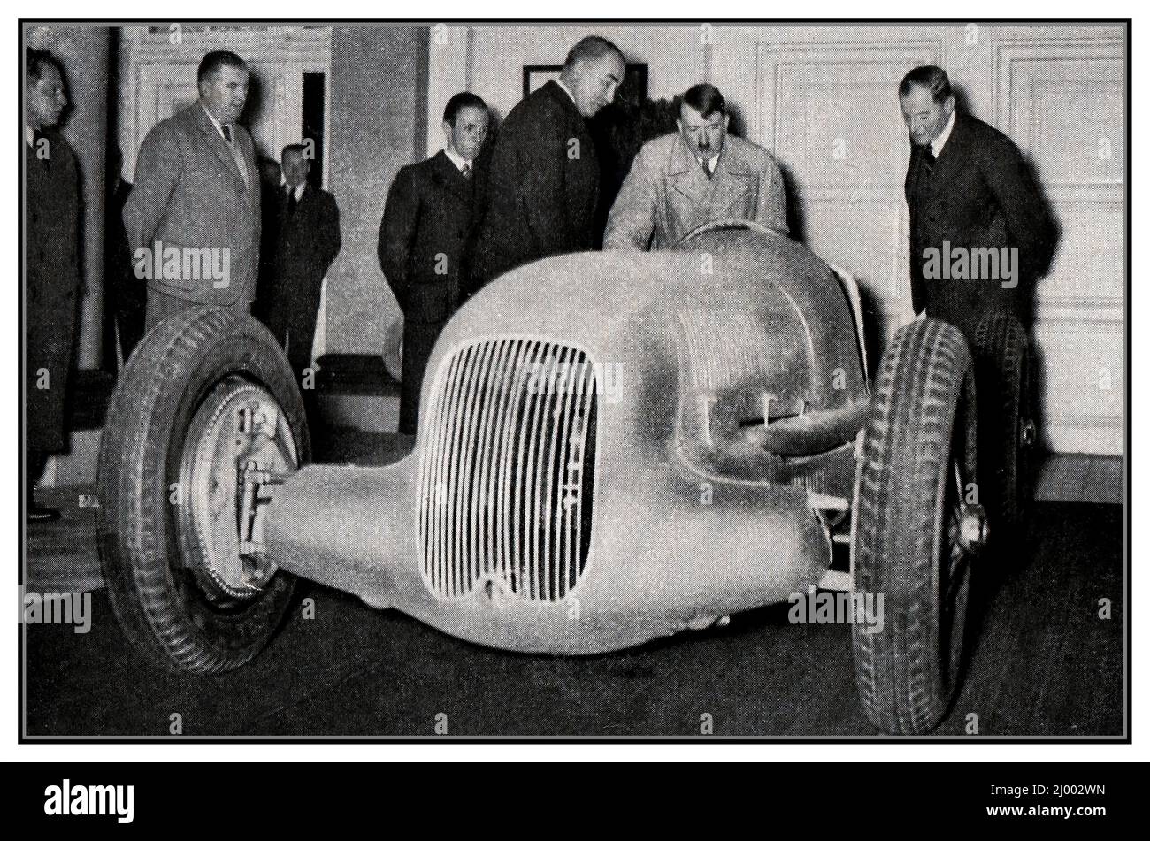 1930s Adolf Hitler MERCEDES racing car with Joseph Goebbels at the launching of the new Mercedes open Grand Prix racing car 'Silver Arrow' model number W24 1934 Also in group Hans Nibel Mercedes designer. Stock Photo