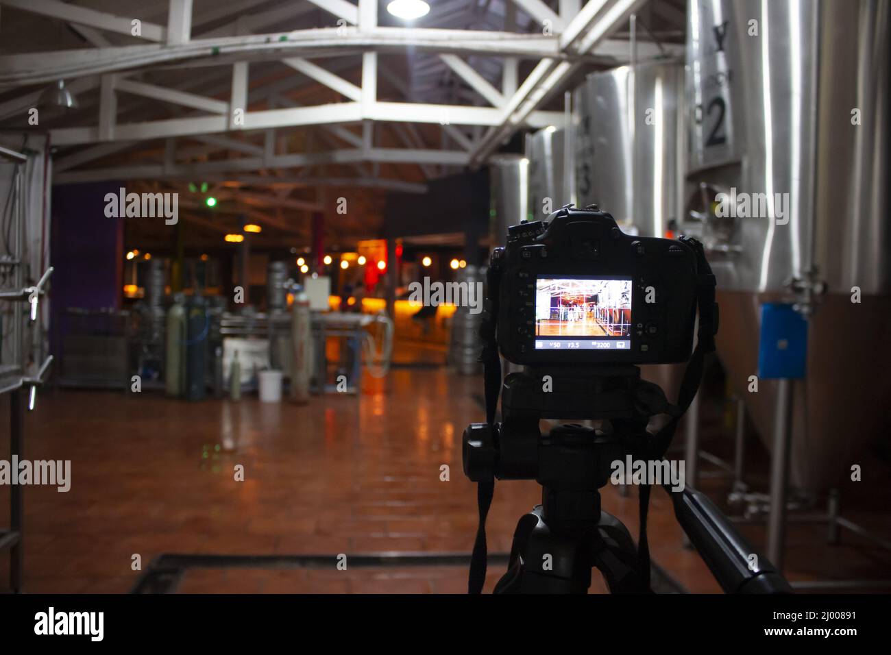 Selective focus of a professional camera recording inside a building ...