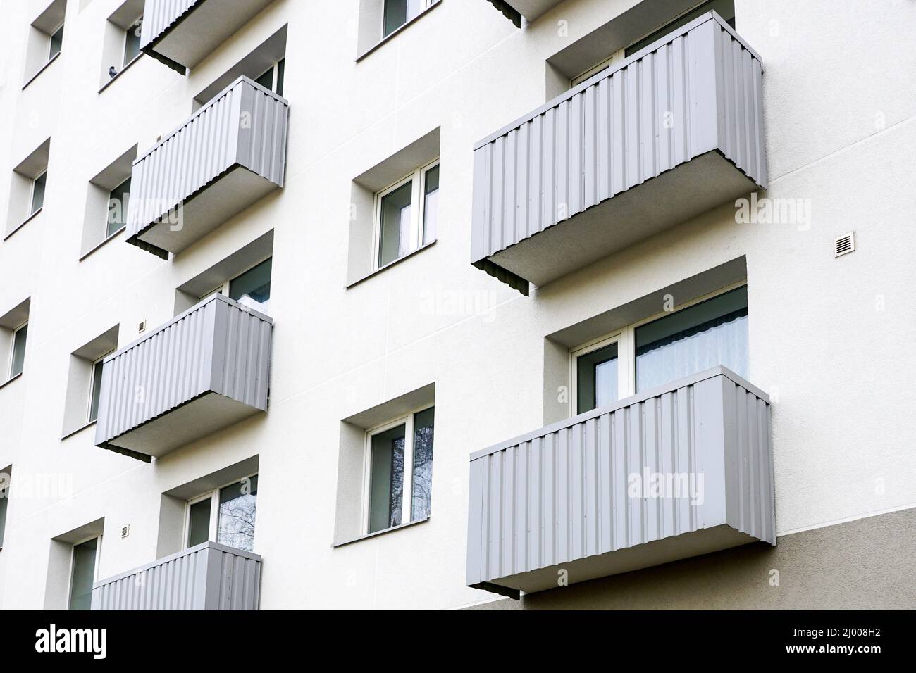 fragment of the facade of a renovated and thermally insulated multi ...
