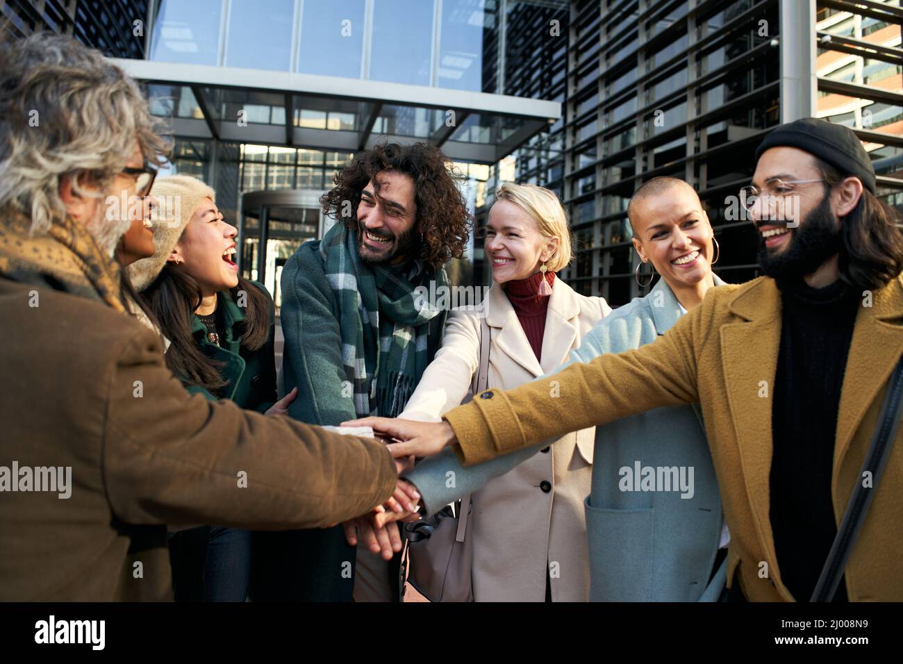 Group of diverse hands together joining hi-res stock photography and ...