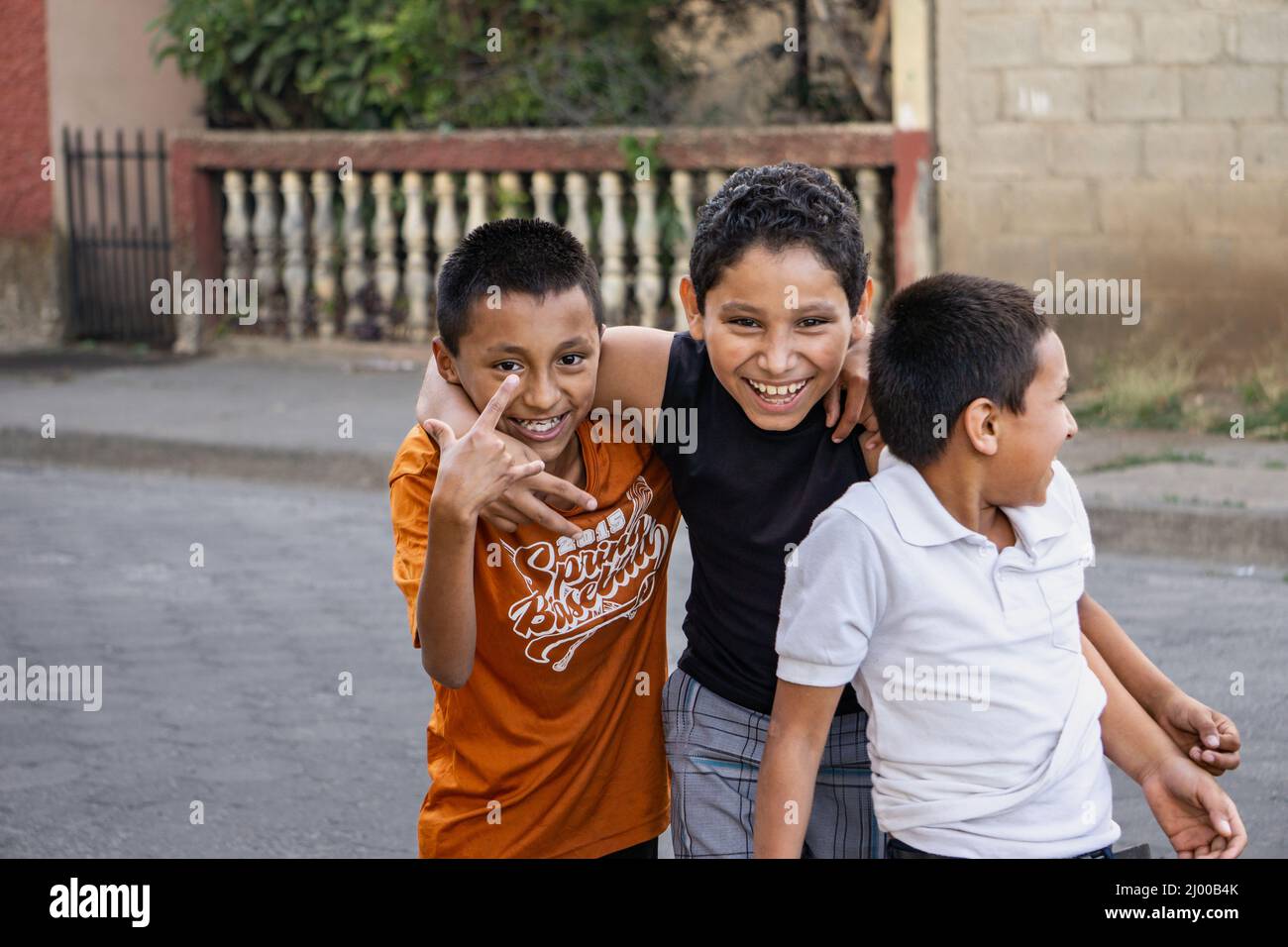 Three boys  in Jinotega, Nicaragua, goof for the camera. Stock Photo