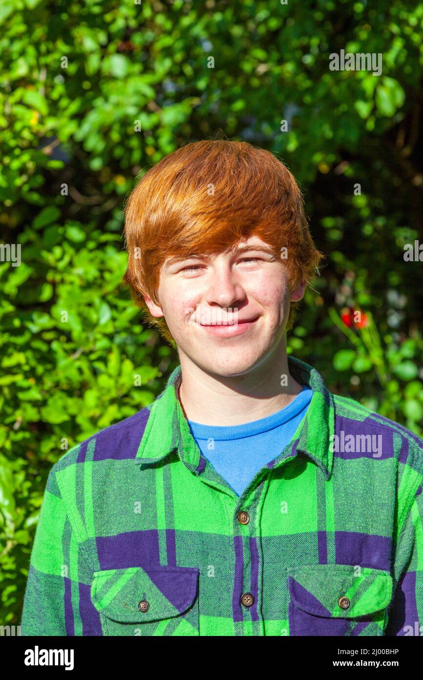 portrait of attractive happy smiling boy in the garden Stock Photo - Alamy