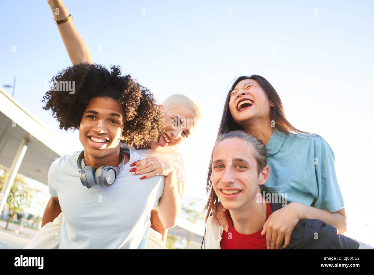 Portrait outside of multiracial friends group. Happy people smiling at camera. Human resources, multicultural boys and girls, college students Stock Photo