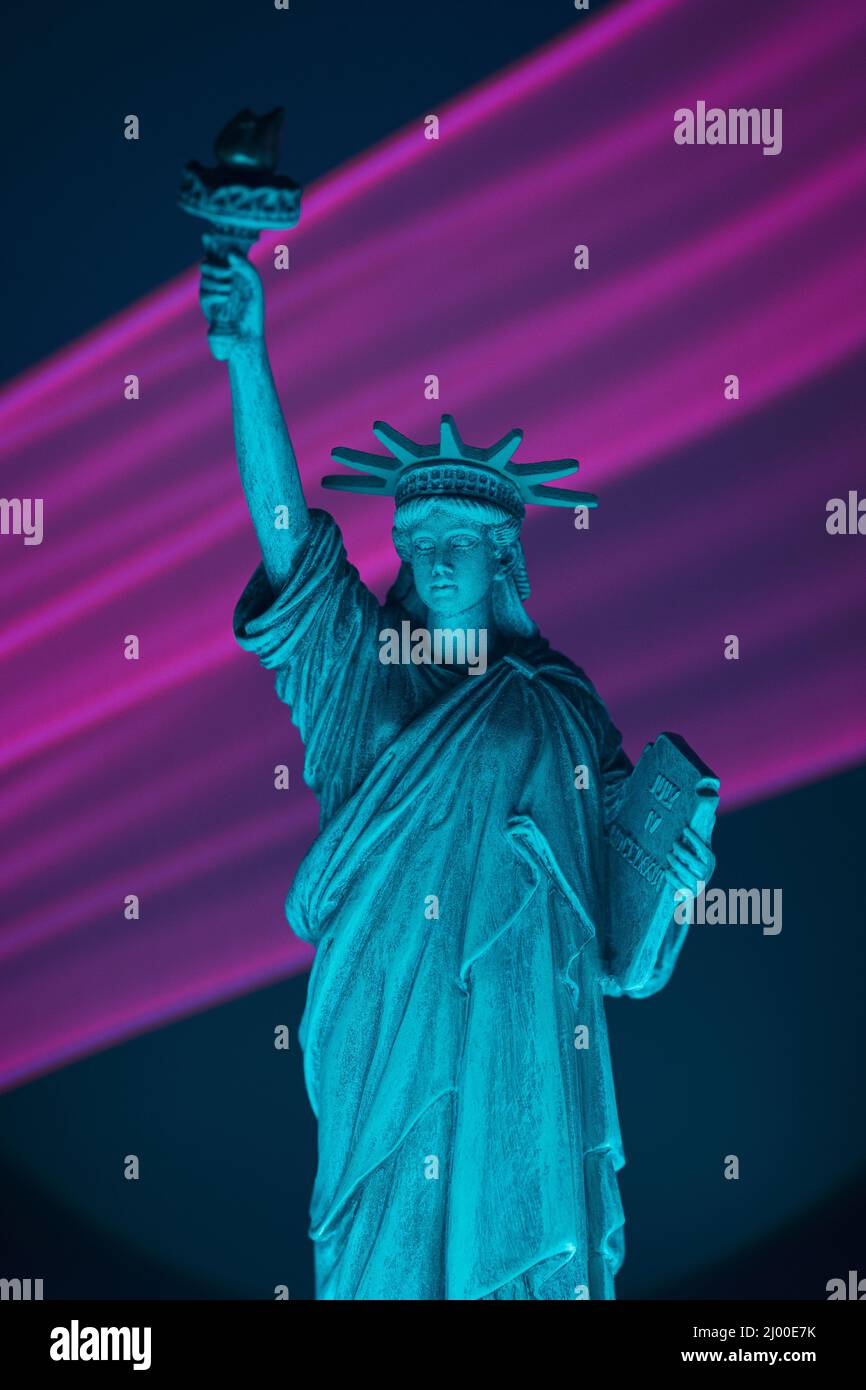 Statue of liberty close up with neon illumination background. USA freedom futuristic concept. Stock Photo