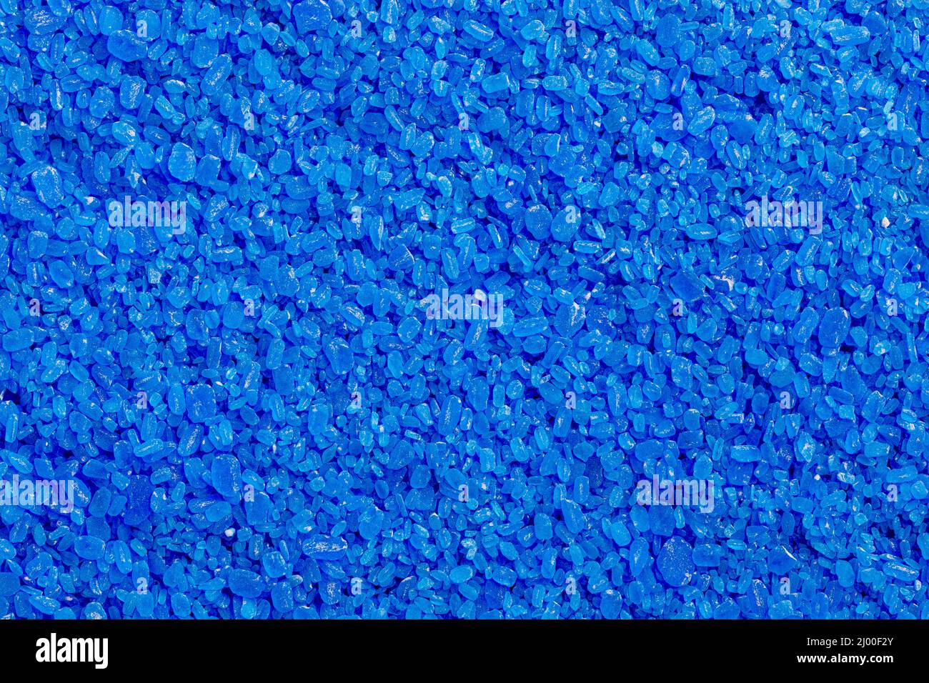 full frame background and texture of blue copper sulfate granules - close-up Stock Photo