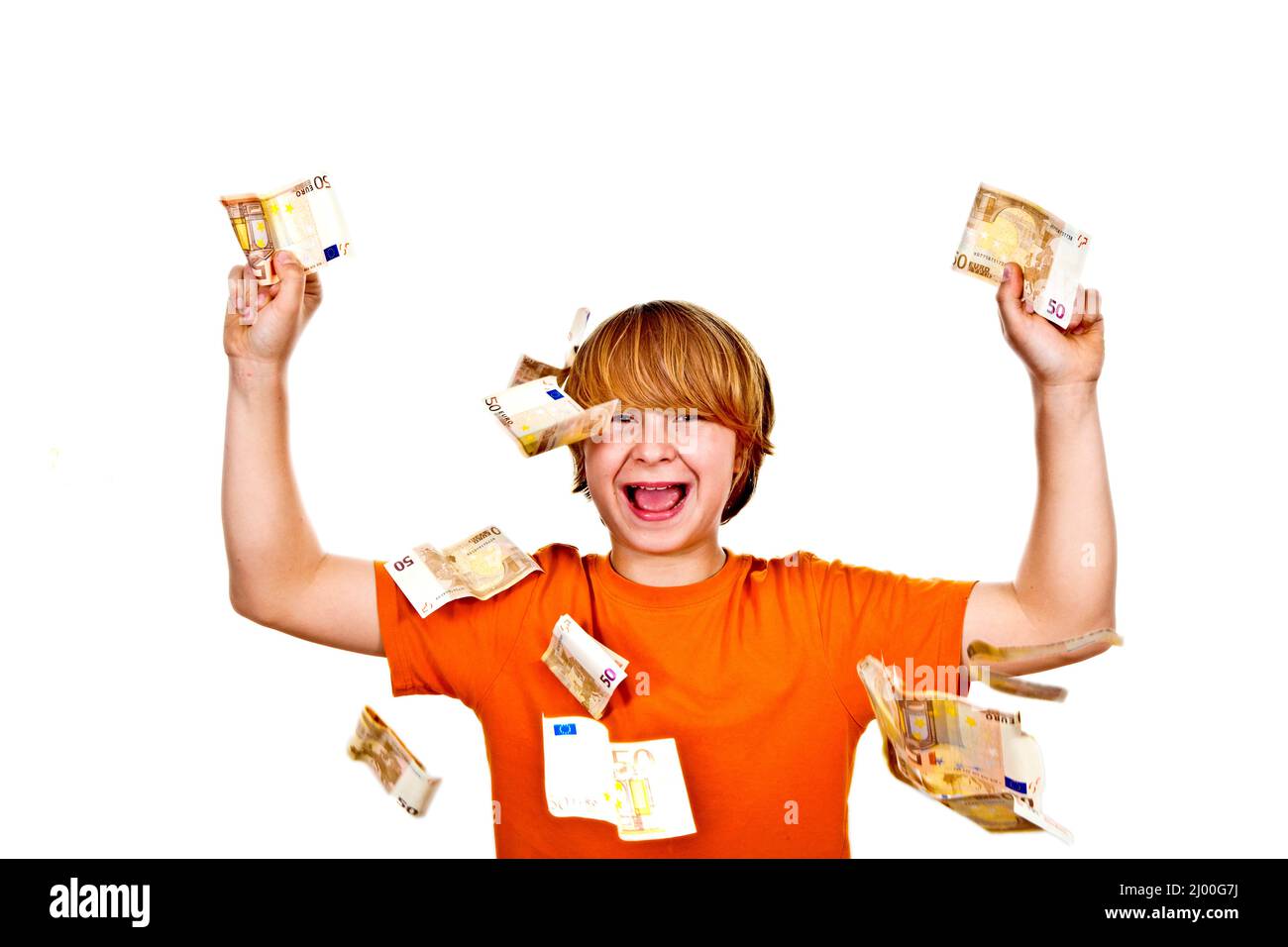 Euros flying around a boys head Stock Photo
