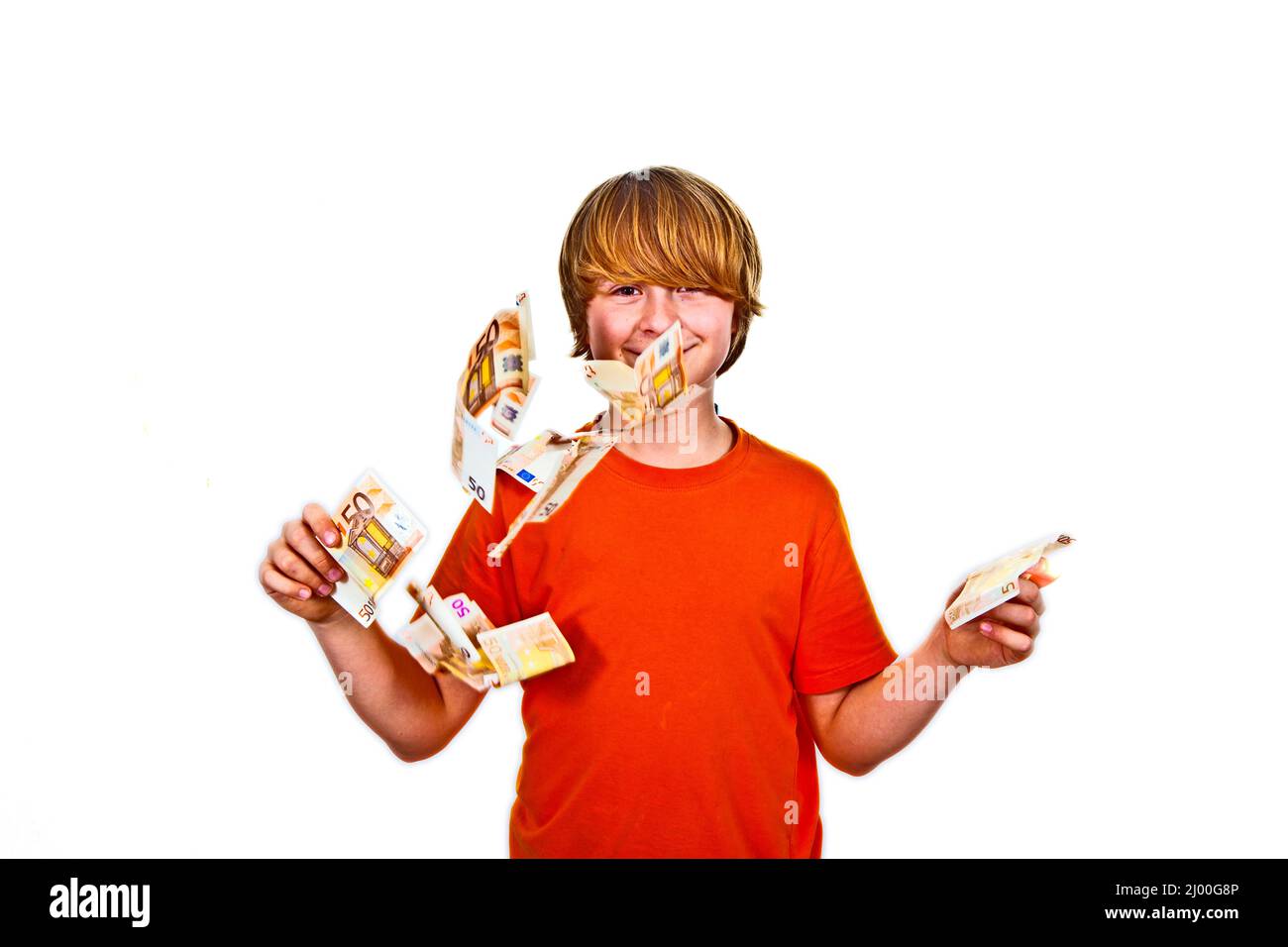 Euros flying around a boys head Stock Photo