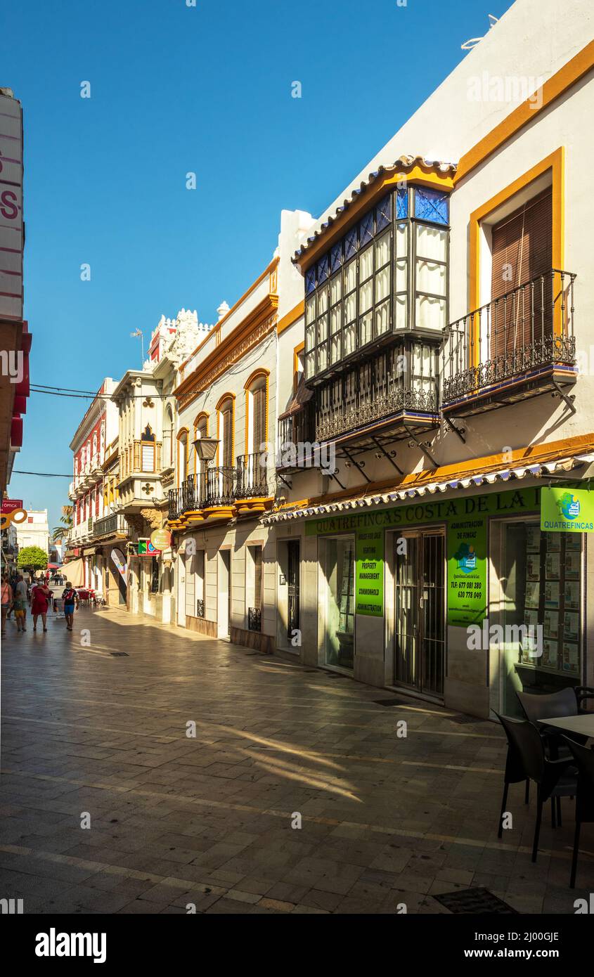 Ayamonte, Spain - July 29, 2021: View of a commercial street in the center of Ayamonte in Spain, with houses of traditional architecture. Stock Photo