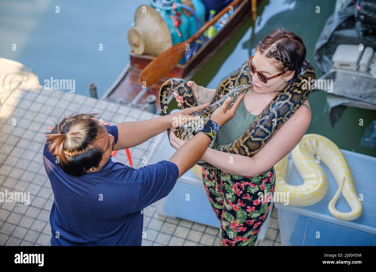 Python snake encounter at Damnoen Saduak Floating Market Stock Photo ...