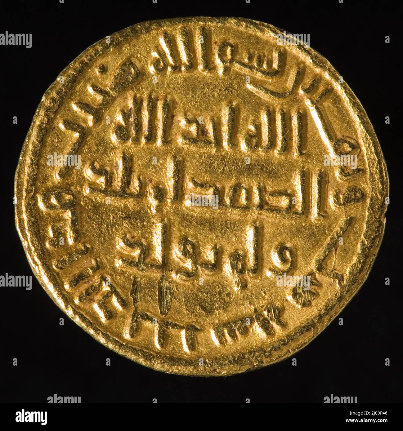Dinar. Umayyad Caliphate, A.H. 86/705 A.D.. Tools and Equipment; coins. Gold Stock Photo