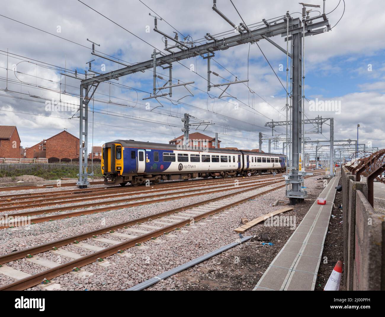 Northern Rail class 156 diesel sprinter train 156454 arriving at the electrified  Blackpool North station Stock Photo