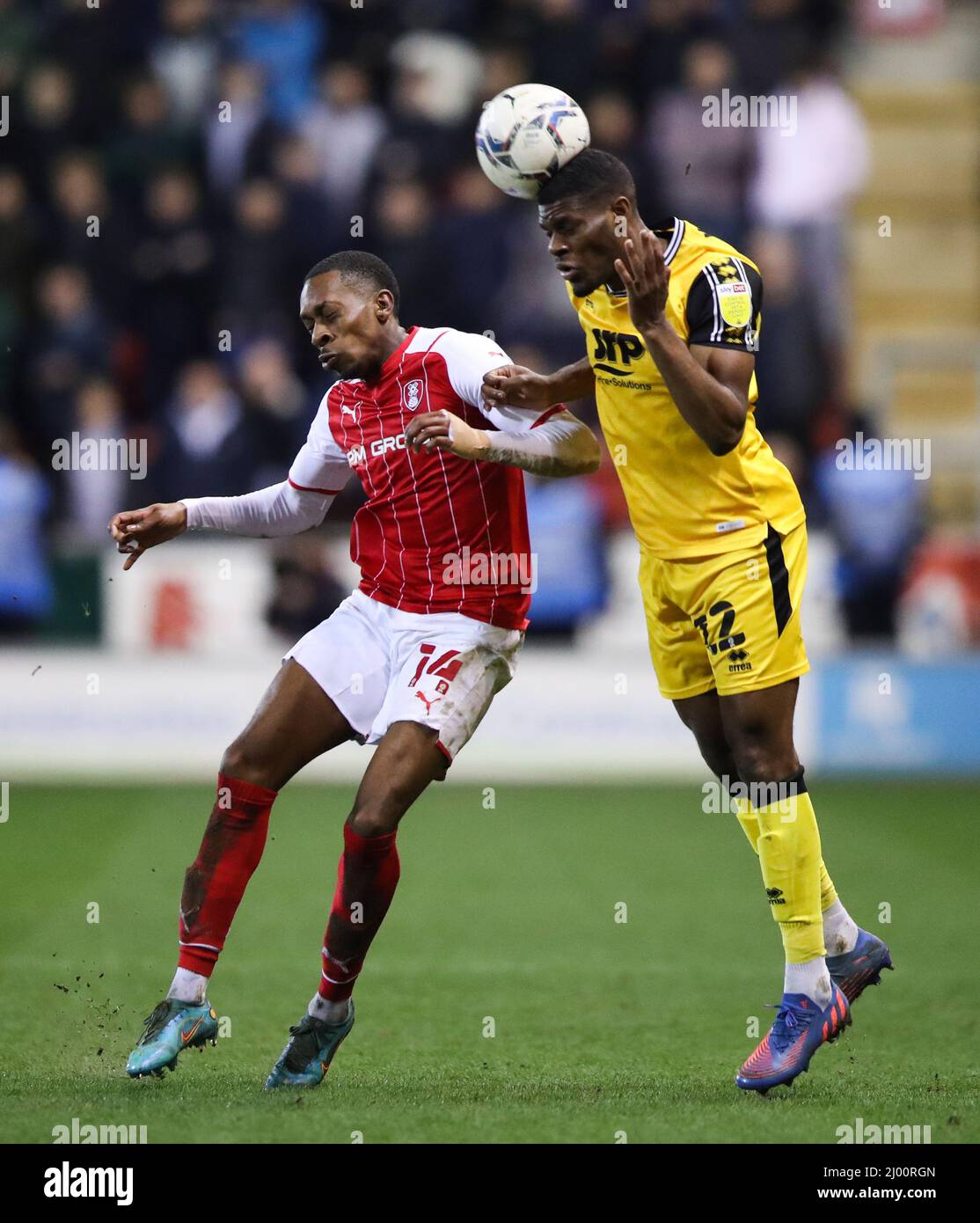 Rotherham United's Mickel Miller (left) Lincoln City’s TJ Eyoma battle for the ball during the Sky Bet League One match at the AESSEAL New York Stadium, Rotherham. Picture date: Tuesday March 15, 2022. Stock Photo