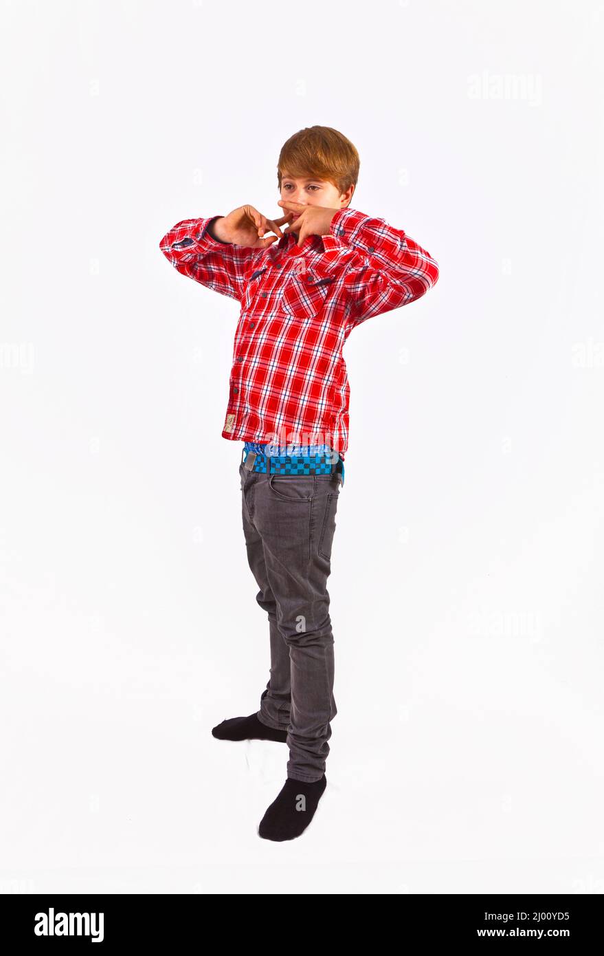 friendly looking young boy with red shirt Stock Photo Alamy