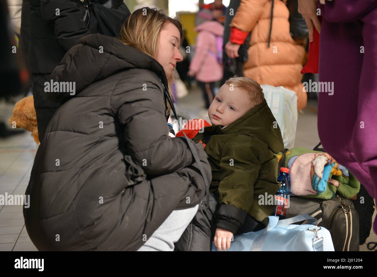 London, England, UK. 15th Mar, 2022. Olga (25) with her son Sviatoslav (2) fleed from Poltava region. Refugees from Ukraine arrive at the train station in Przemysl, Poland, on the 20th day of the Russian invasion of their country. (Credit Image: © Thomas Krych/ZUMA Press Wire) Stock Photo