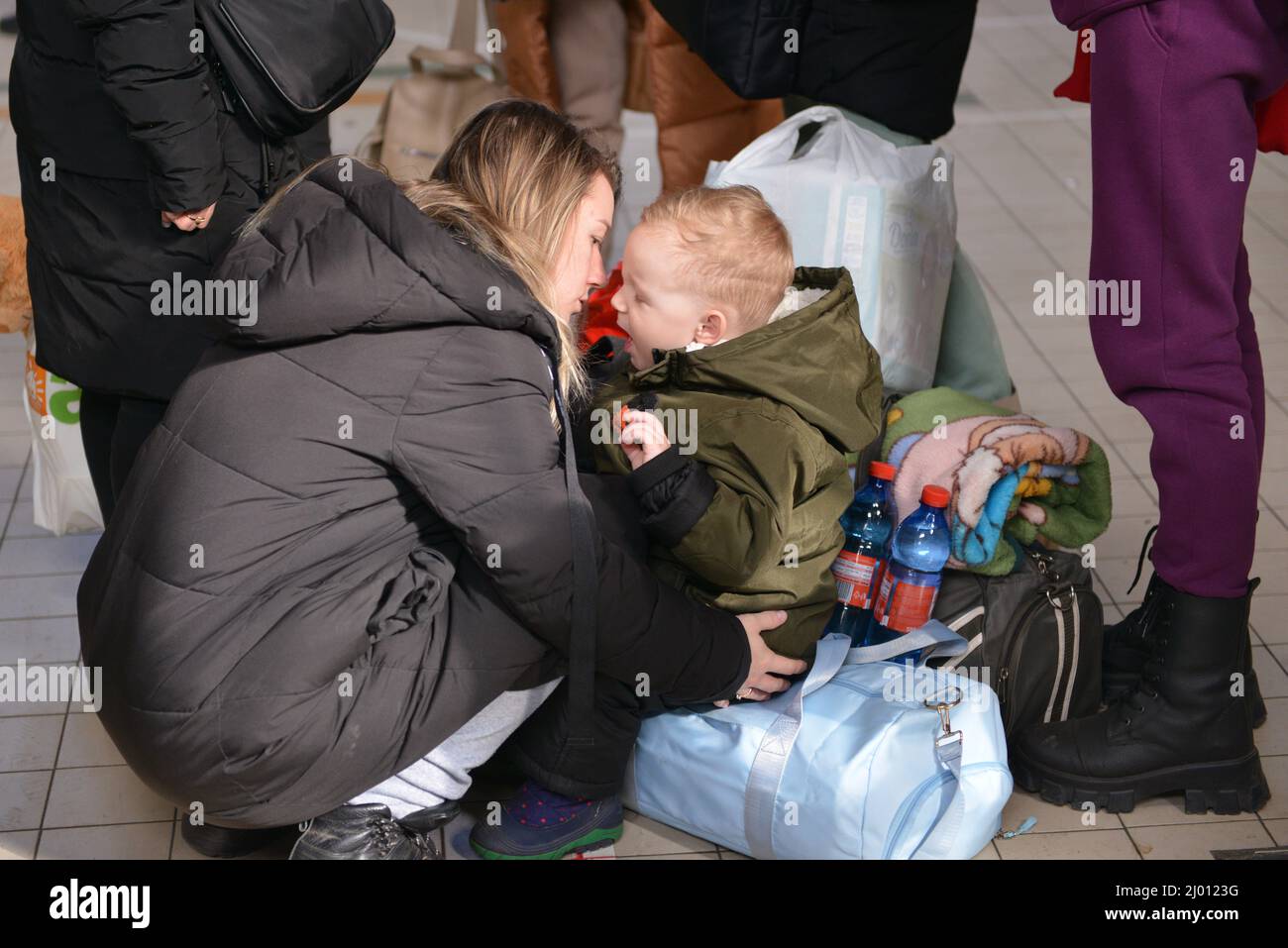 London, England, UK. 15th Mar, 2022. Olga (25) with her son Sviatoslav (2) fleed from Poltava region. Refugees from Ukraine arrive at the train station in Przemysl, Poland, on the 20th day of the Russian invasion of their country. (Credit Image: © Thomas Krych/ZUMA Press Wire) Stock Photo