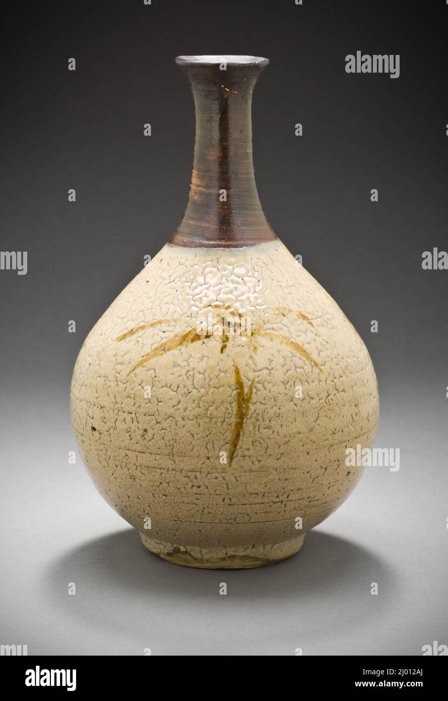 Sake Bottle with Sasa Bamboo Design. Japan, Edo period (1615-1868), first half 18th century. Ceramics. Hizen ware; stoneware with white slip, iron and clear glazes Stock Photo