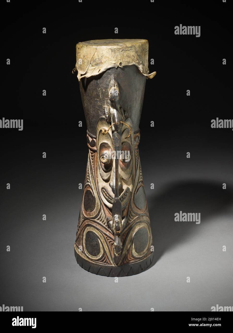 Hand Drum. Papua New Guinea, East Sepik Province, Eastern Iatmul People, circa 1909. Tools and Equipment; musical instruments. Wood, fiber, shell, animal hide, and pigment Stock Photo