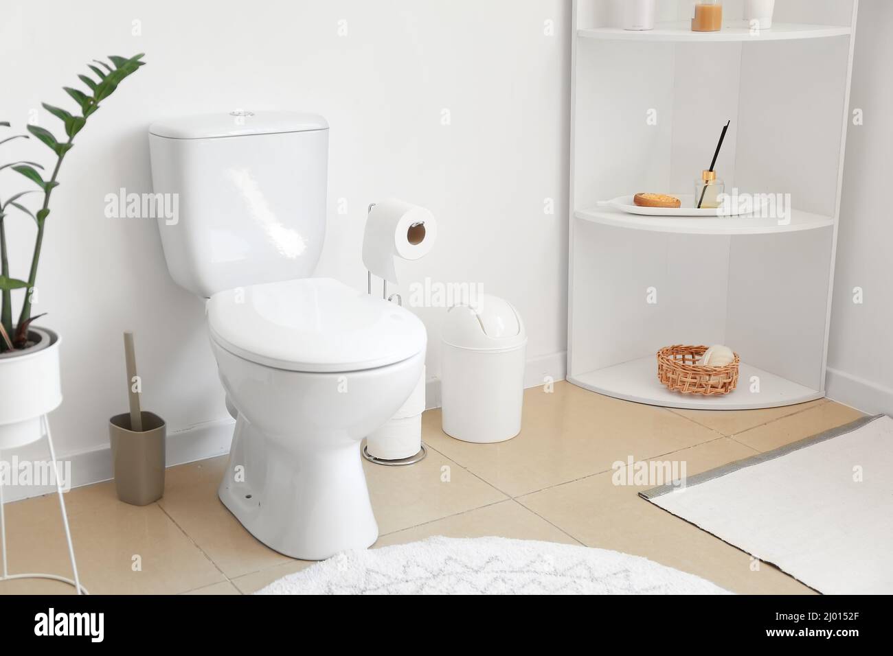 Interior of stylish modern restroom with toilet bowl Stock Photo - Alamy