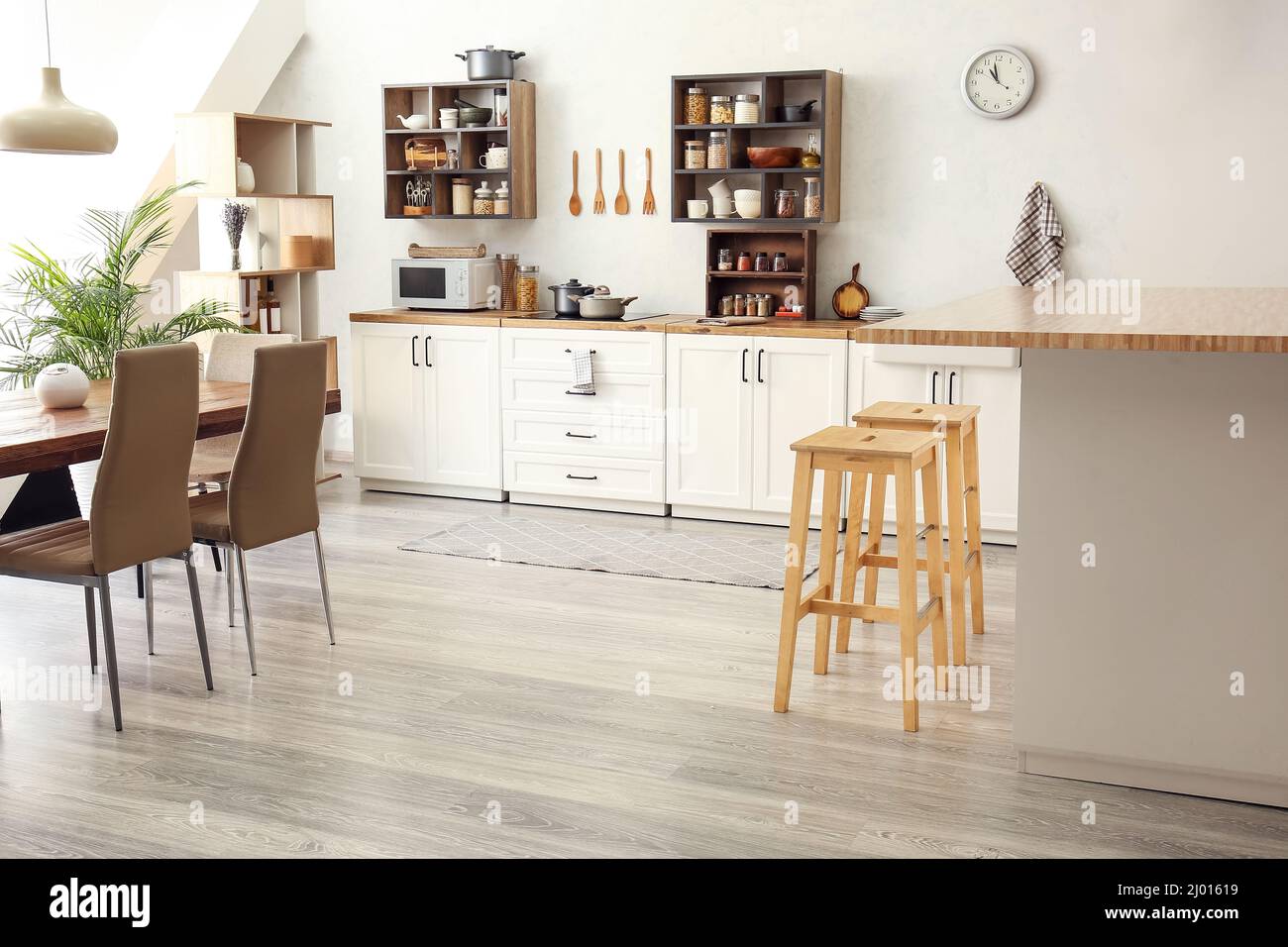Interior of light modern kitchen with white counters and food Stock ...