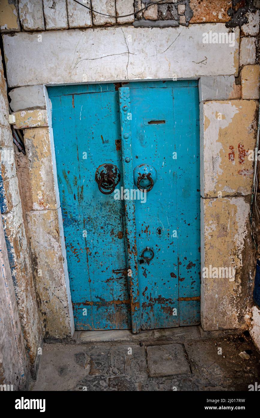 Traditional blue door of an antique house in an alleyway of the Medina (old city) of Tunis, Tunisia. Stock Photo