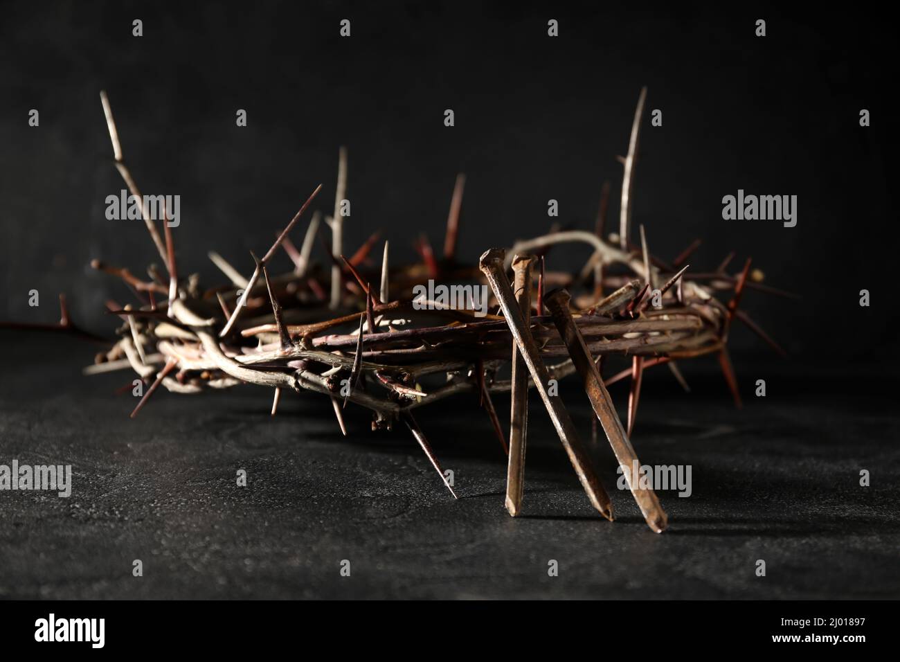 Crown of thorns with nails on dark background Stock Photo - Alamy