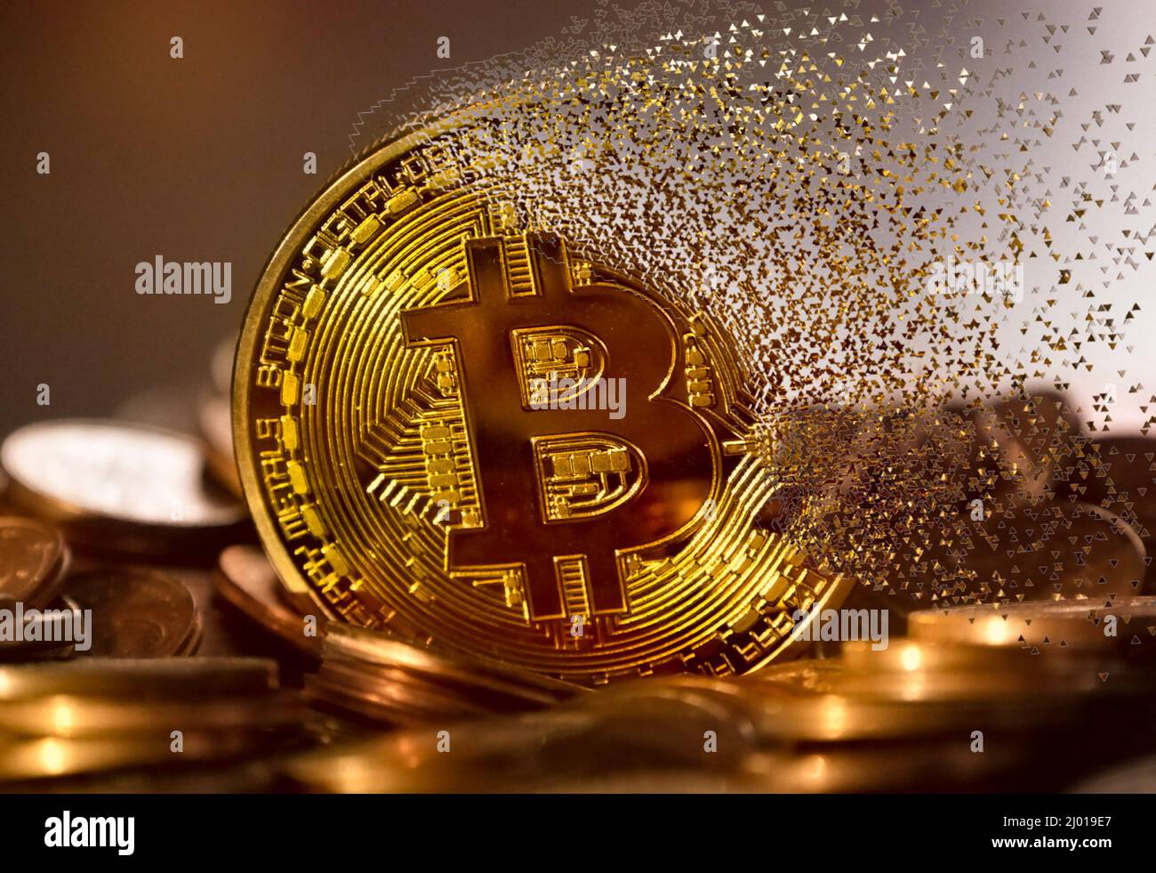A bitcoin fading away with particles. High quality photo Stock Photo - Alamy