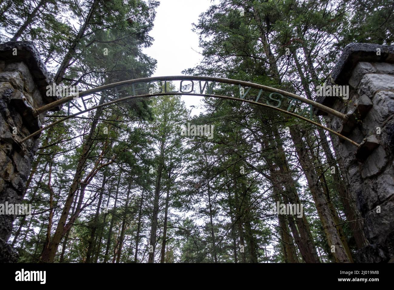 Friday Harbor, WA USA - circa November 2021: Low angle view of the Afterglow Vista gated entrance to the mausoleum on a rainy, overcast day. Stock Photo