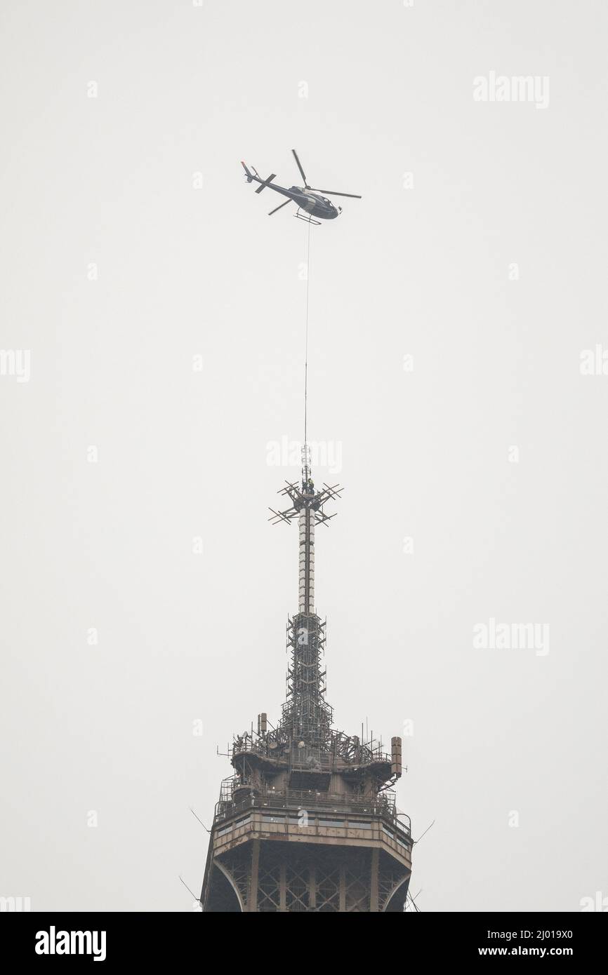 Paris, France. 15th Mar, 2022. A helicopter lifts a new antenna to the