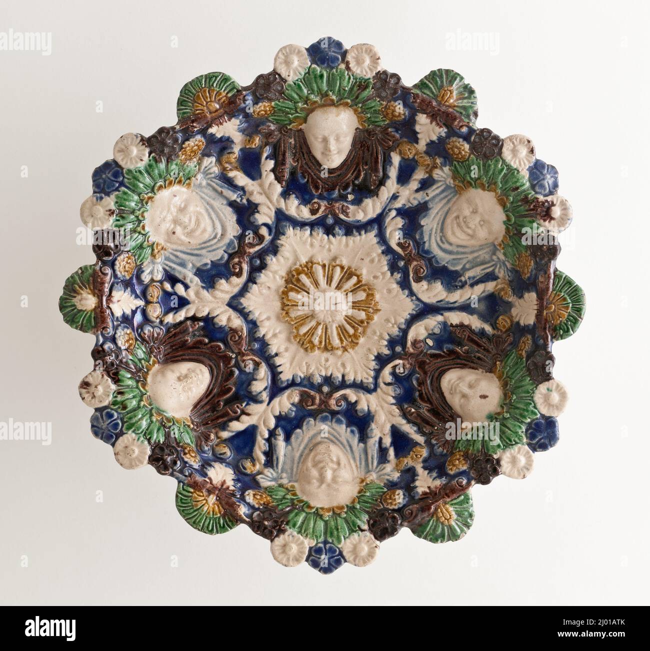 Shallow Bowl with Grotesque Masks. Palissy (after), Bernard (France, 1509–1590). France, circa 1560-1600. Furnishings; Serviceware. Lead-glazed earthenware, Palissy ware Stock Photo