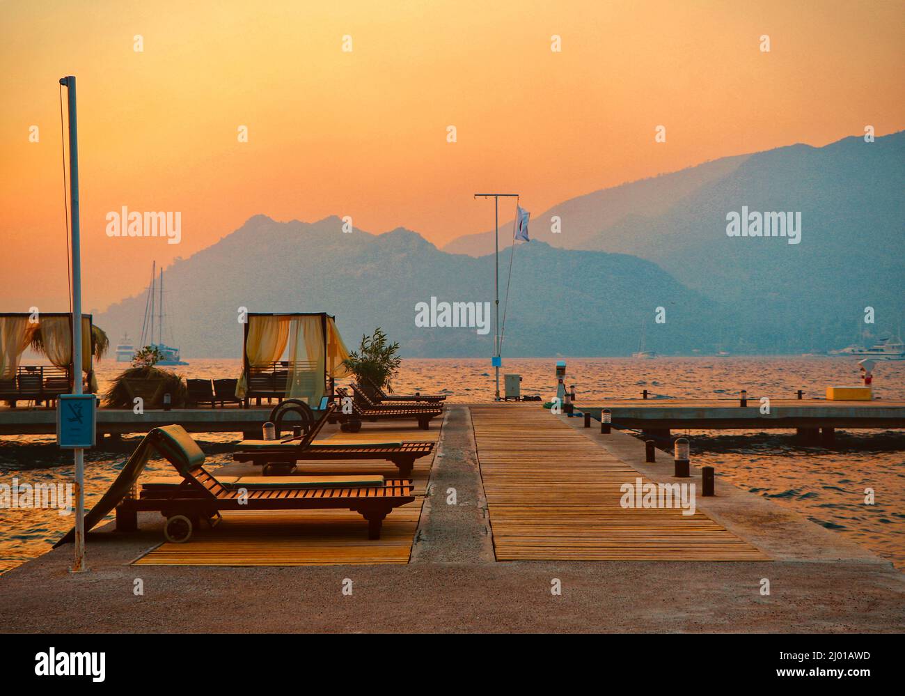 Beautiful sunset over a platform and dock Stock Photo - Alamy