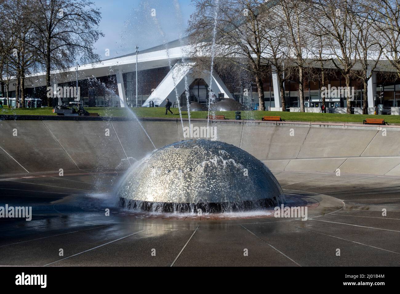 Seattle, WA USA - circa March 2022: Gorgeous view of the International Fountain near the Space Needle in the downtown area on a bright, sunny day. Stock Photo